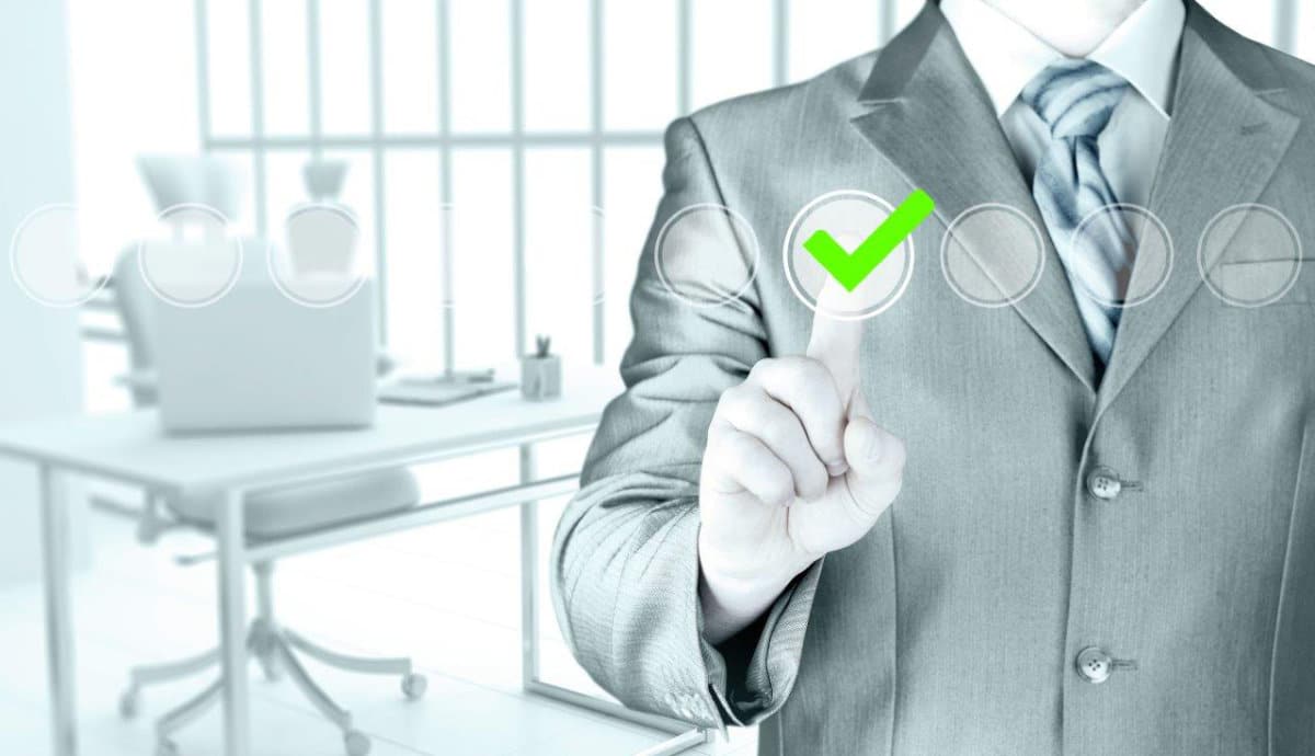 Man in suit checking a checkbox